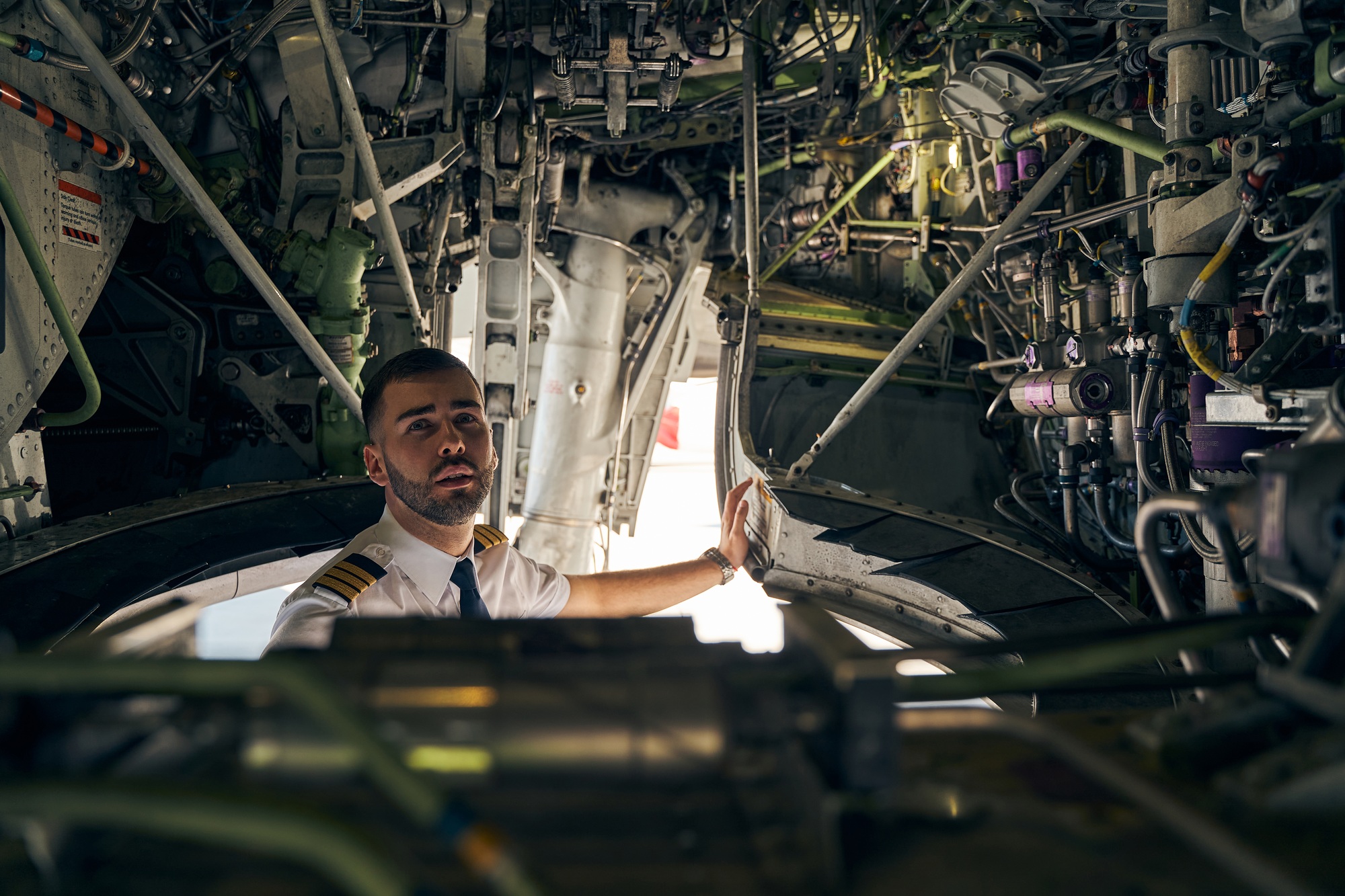 Focused young pilot inspecting an air vehicle